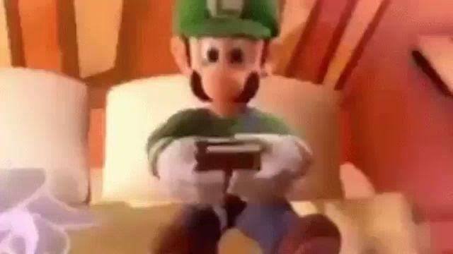 a cartoon character is sitting on a bed holding a game controller .