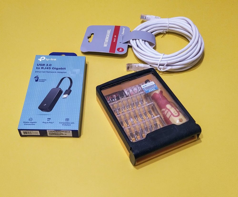 Ethernet cable, USB to Ethernet adapter and toolset.
