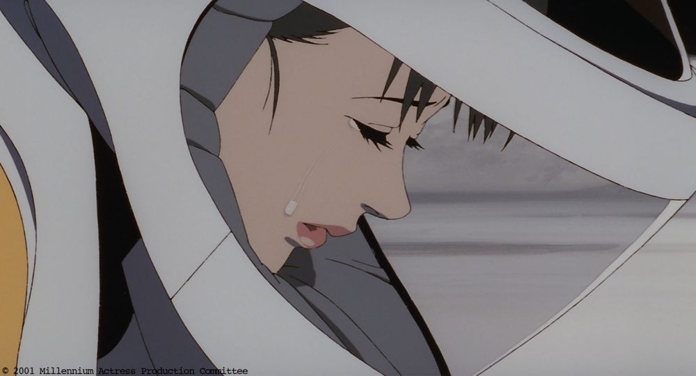 Adult Chiyoko crying in her astronaut suit