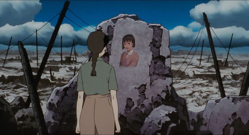 Chiyoko finds a portrait of her younger self on some rubble remaining after an air raid