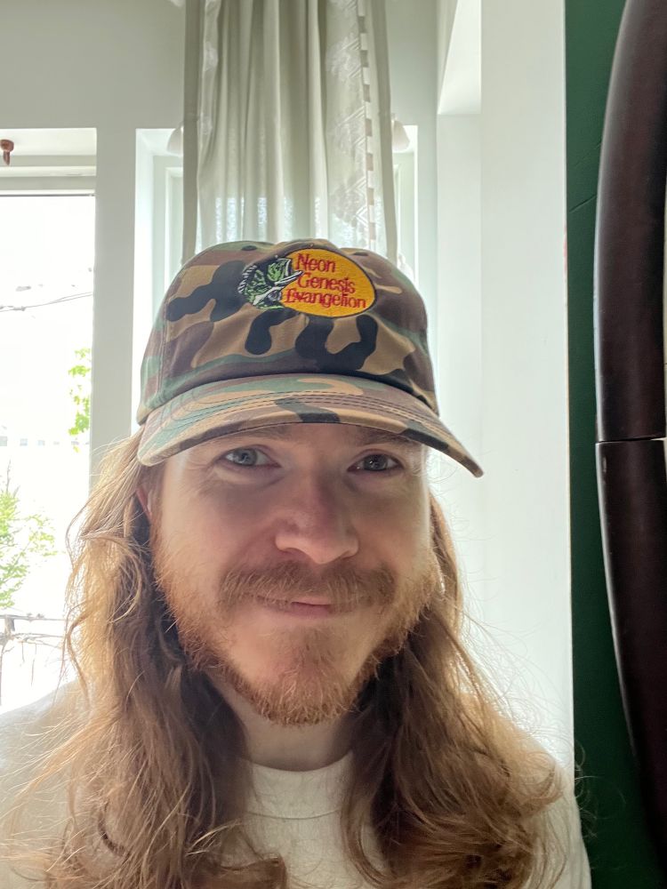 Hat with a bass pro shop logo that reads “Neon Genesis Evangelion”