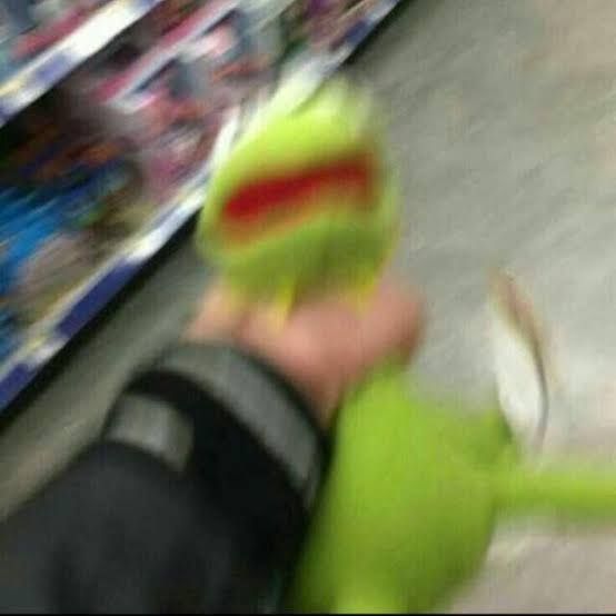 a kermit the frog doll being strangled 