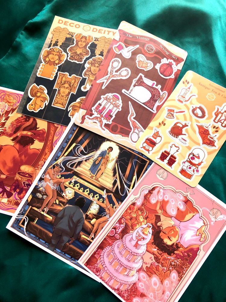 Collection of postcard prints featuring Gatsby at the bottom and sticker packs featuring tea, sewing, and art deco heads at top