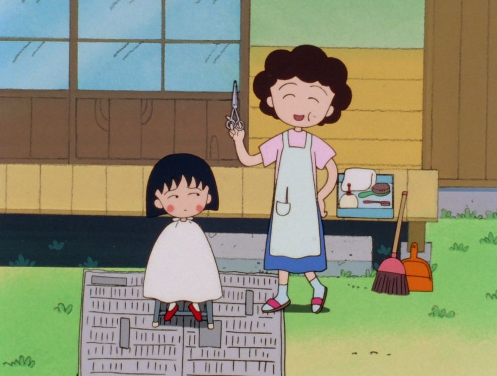 Maruko looks apprehensive while her giddy mother prepares to cut her hair.