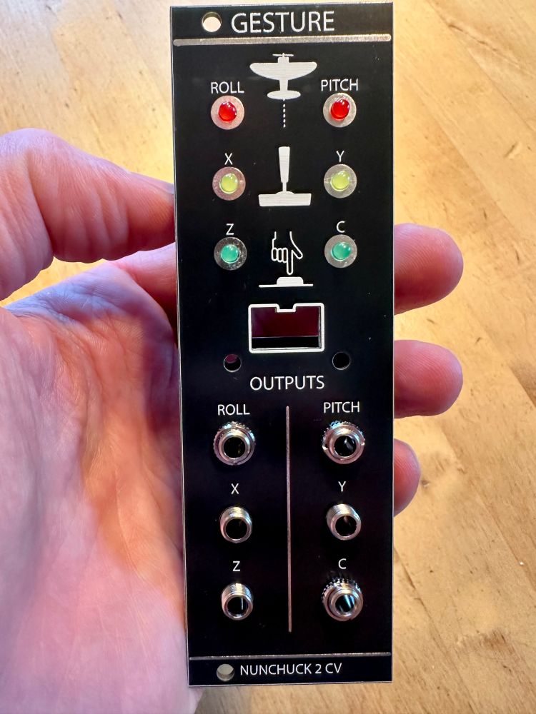 A synthetic module under construction with a black faceplate and some components mounted 