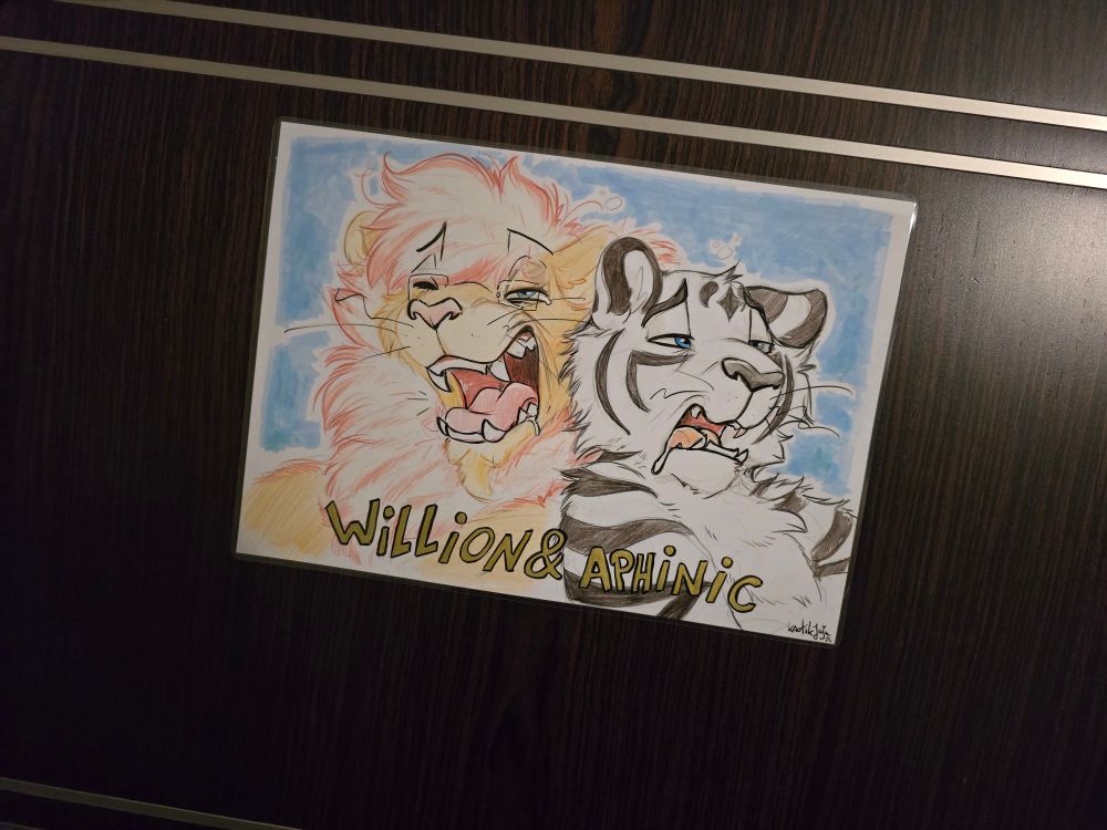 The most amazing furry kitties - a king like lion and a god like tiger - being shown in an even more amazing artwork looking pretty pent up.