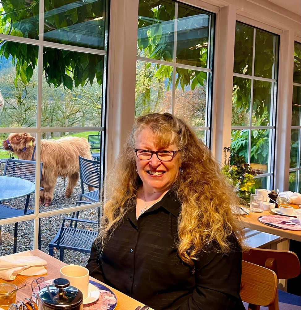 Wendy at Monachyle Mhor with Donald the Highland coo