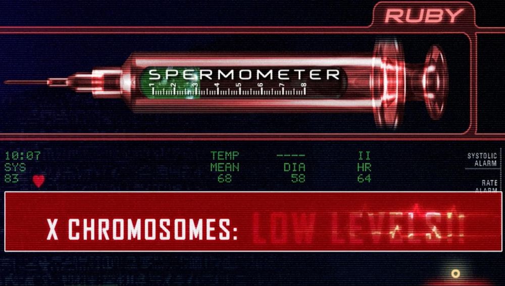 A still from the film Teknolust displaying a movie user interface with a “spermometer” and text that warns of low levels of x chromosomes