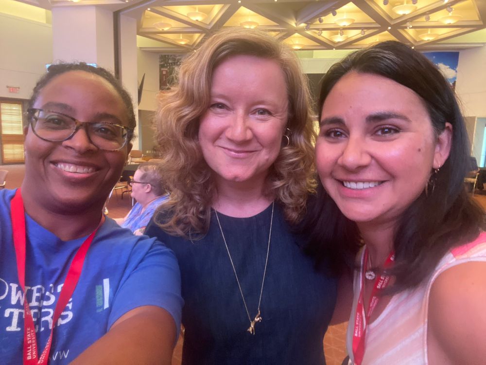 Three writers posing at Midwest Writers Workshop