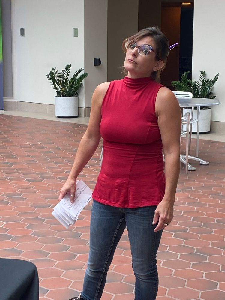 Photo of our Executive director playfully frowning at the camera
