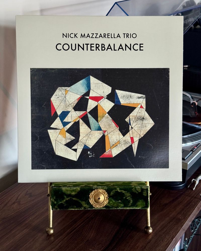 Vinyl copy of the Nick Mazarrella Trio’s album “Counterbalance” sitting on a velvet Victorian photo stand. The record plays on a turntable in the distance.


#nowspinning
#freejazz
#astralspirits