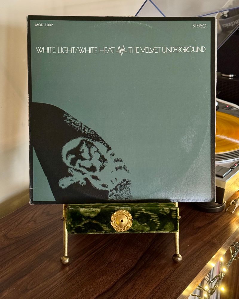 Vinyl copy of The Velvet Underground’s “White Light/White Heat” sitting on a velvet Victorian photo stand. The record plays on a turntable in the distance.



#velvetunderground
#nowplaying
#sisterray