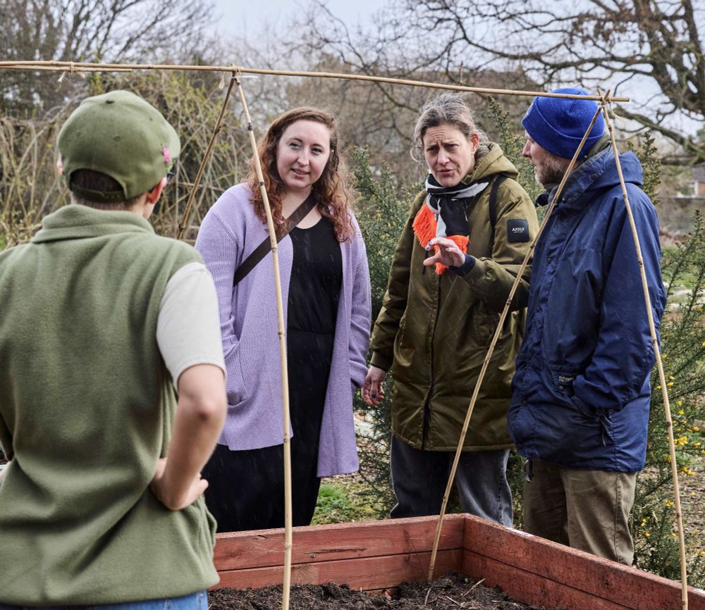 Researchers Rebecca and Marie and Pete from Hyde Park Source chat to local resident Jess Hughes