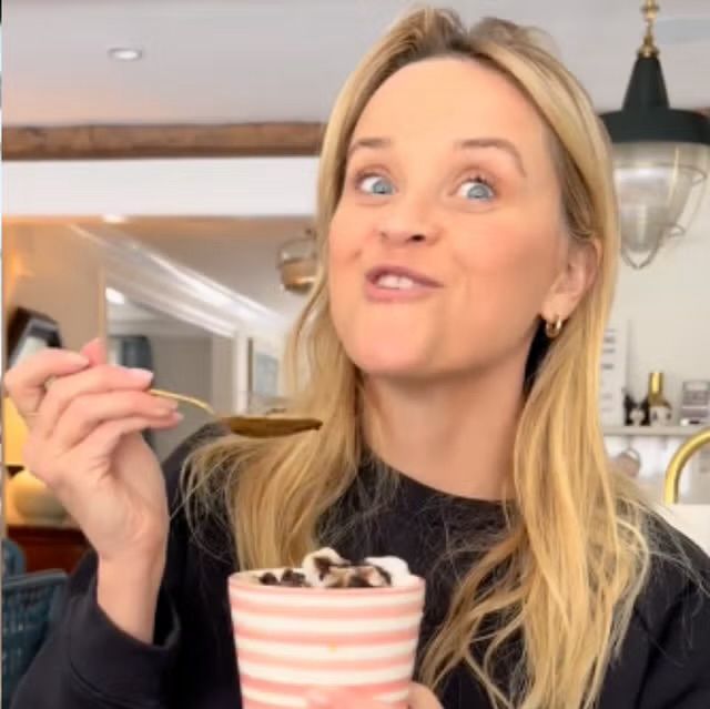 Reese Witherspoon eating ice cream and smiling 