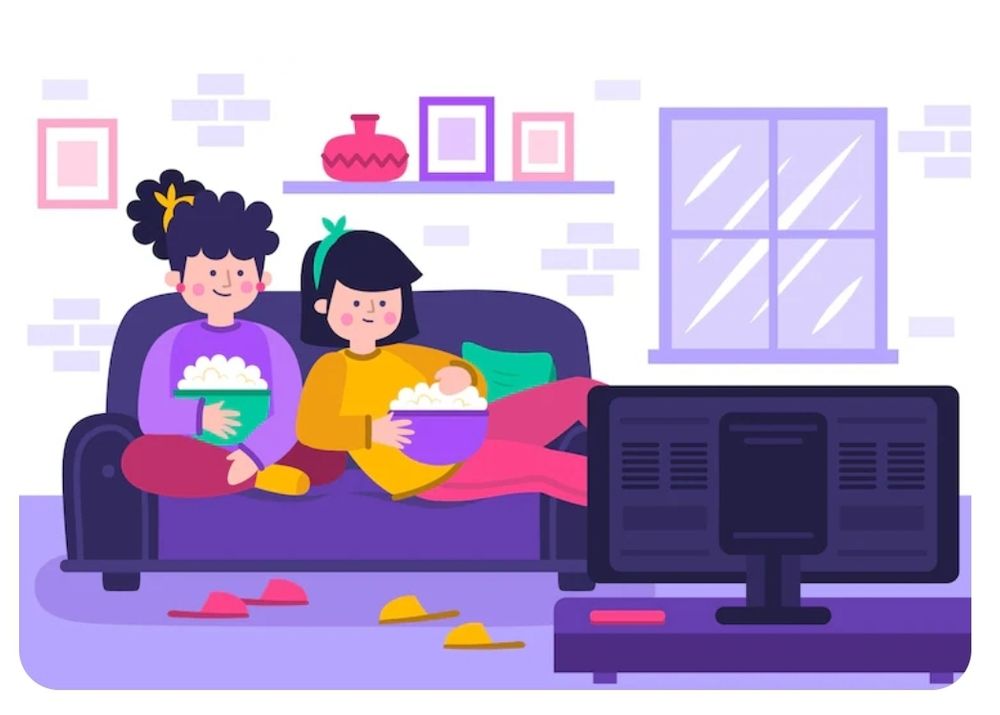 Two girls on the soft eating popcorn & watching tv. #WeekendWatching 