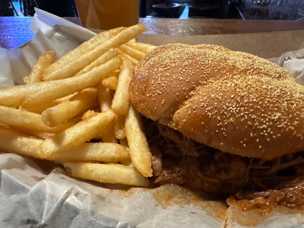 BBQ pork sandwich, French fries, Blue Moon 
