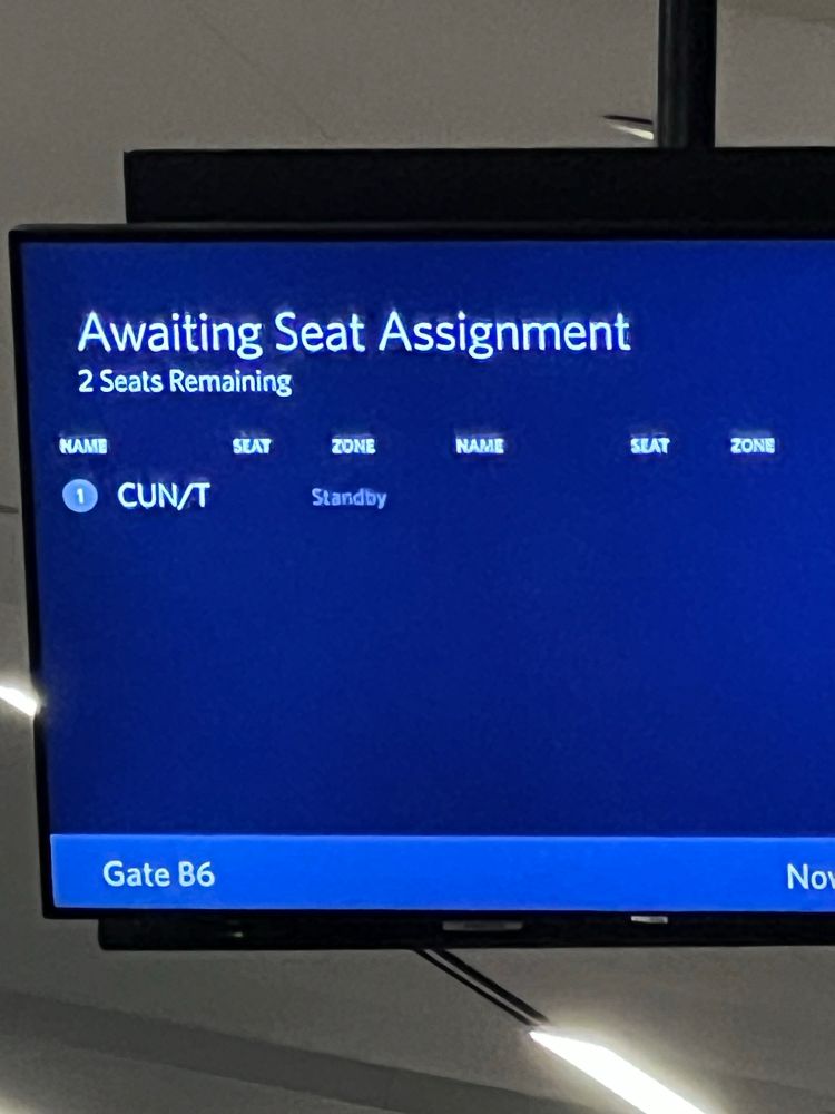 A picture of a Delta start clearance screen at ATL airport- a person with the unfortunate name abbreviation CUN/T was been cleared for a seat.