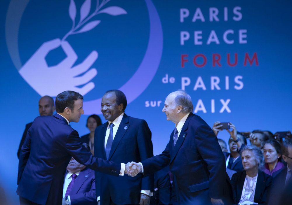 His Highness Prince Karim Aga Khan shakes hands with President Emmanuel Macron during the second edition of the Paris 

Peace Forum on November 12, 2019.