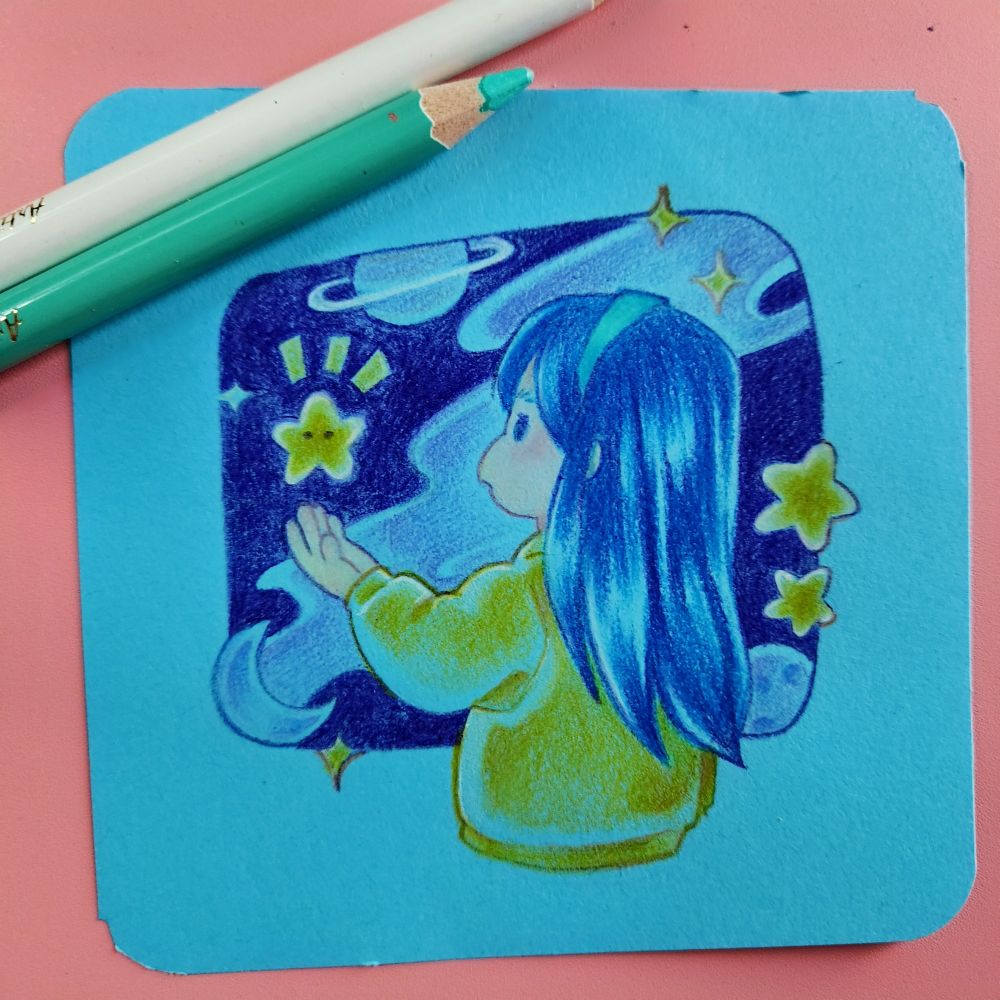 Chibi pencil crayon illustration on bright blue paper, depicting a girl in an oversized yellow jacket staring in wonder at a cartoons star hovering above her hand. She has long blue hair and a green headband. The backdrop is an abstraction of the milky way galaxy and stylized stars and planets.