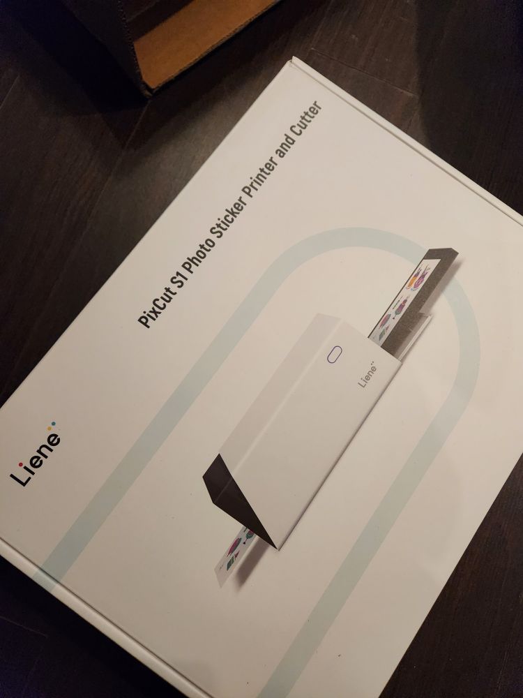 A photo of an unopened Liene PixCut S1 Photo Sticker Printer and Cutter. 