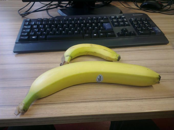 Keyboard with banana. Additional banana for scale.