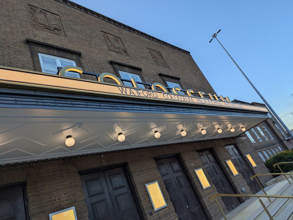The newly refurbished entrance to Watford's Colosseum. Above the entrance doors are the words: Watford Colosseum Relaunching Autumn 2025