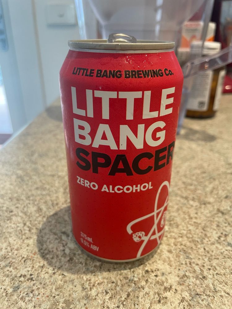 A red beer can that says Little Bang Spacer, zero alcohol. 
