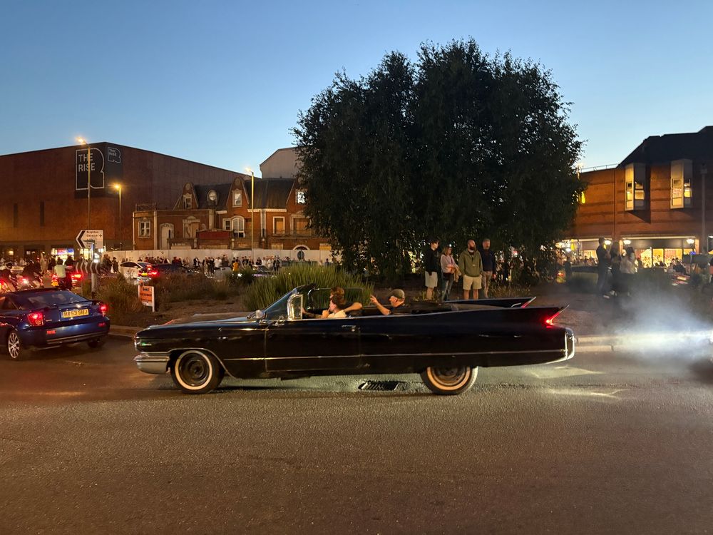 I honestly don’t know enough about cars to tell you about this. But it’s one of those cool cars from like Grease the musical going around a roundabout