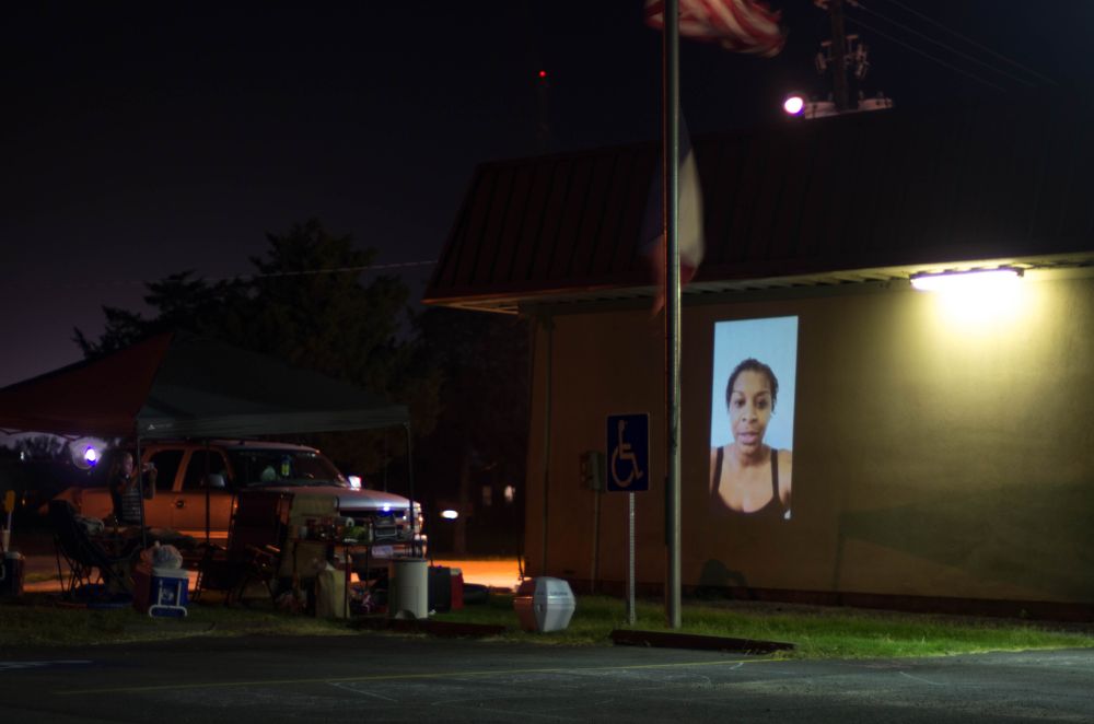 Sandra Bland's image projected on to the Waller County jail a year after she passed