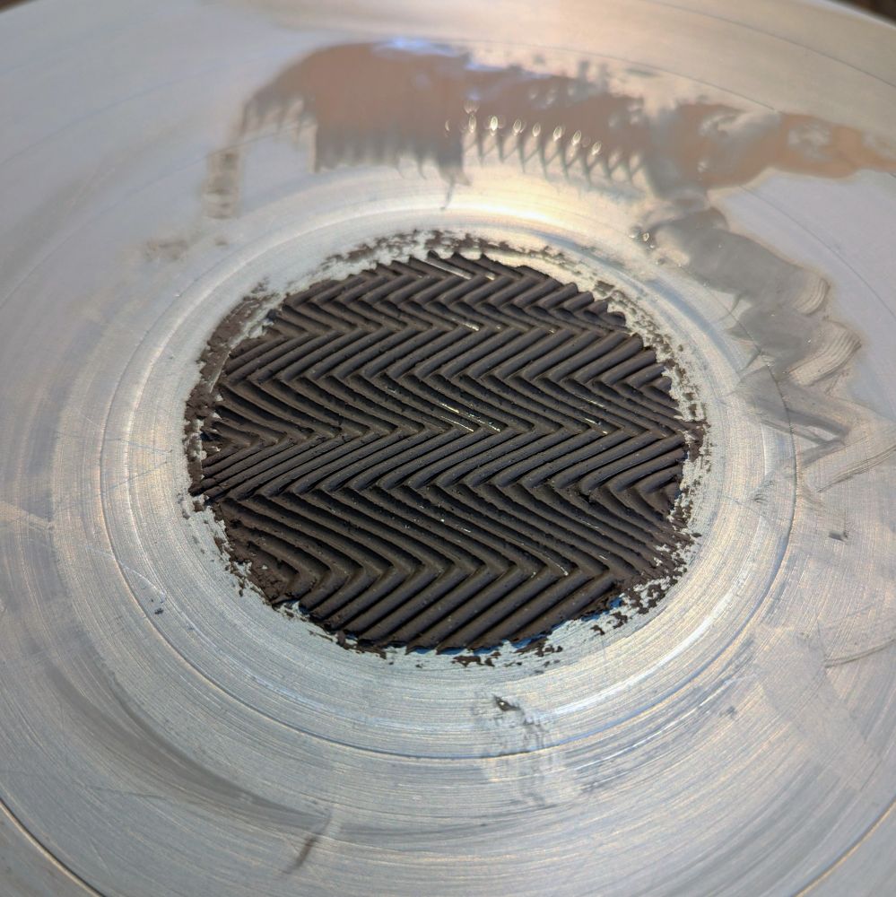 a zig zag pattern left behind on the wheel head from a clay piece wired off by wiggle wire