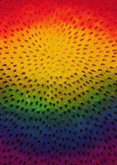 Print with abstract design in rainbow colours with small black triangles