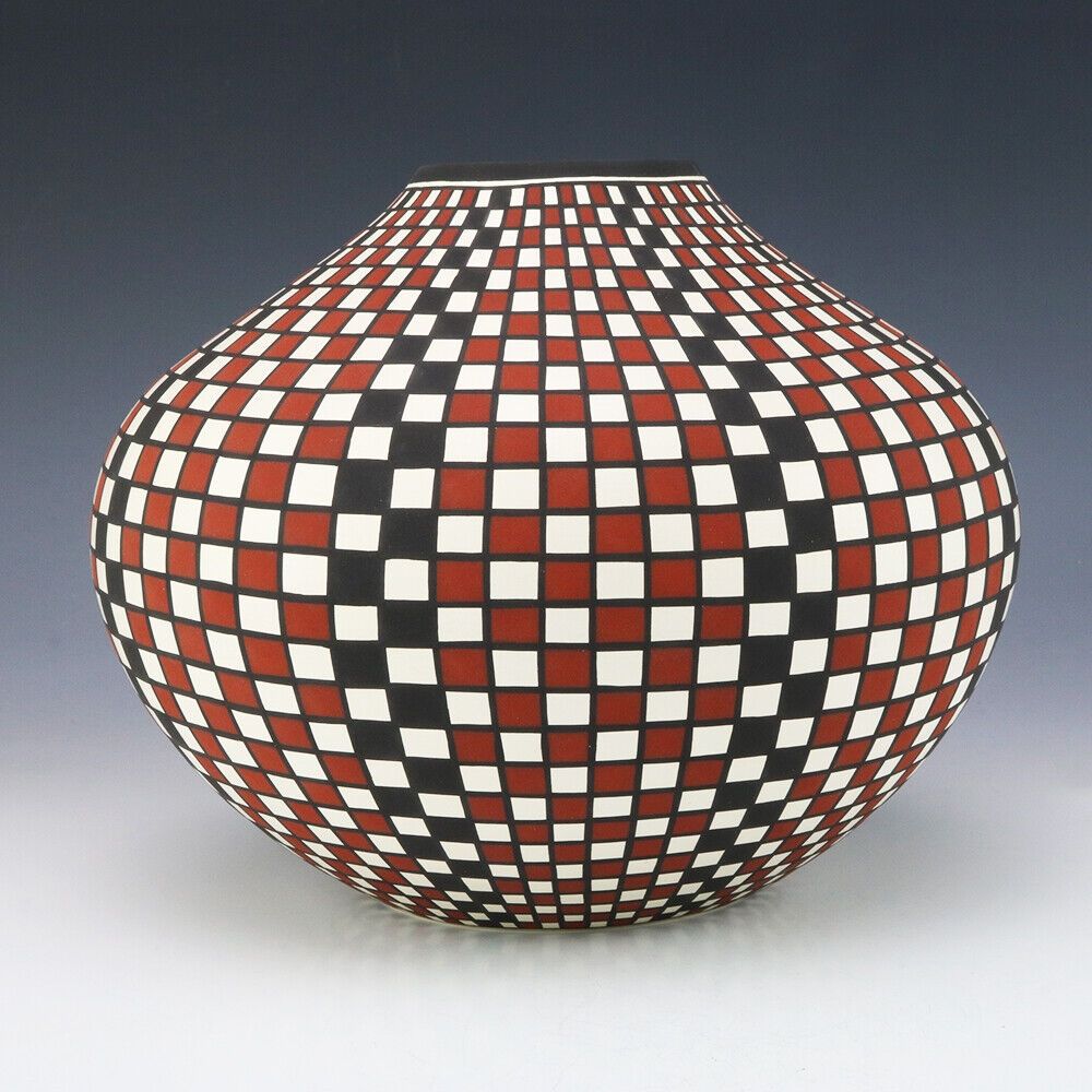 Ceramic vase with repeated square motifs in orange, green and white