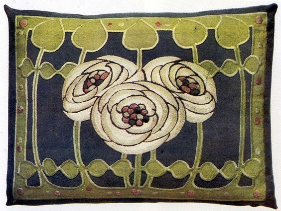 Embroidered cushion cover witj three stylised white roses and leaves on a dark blue background 