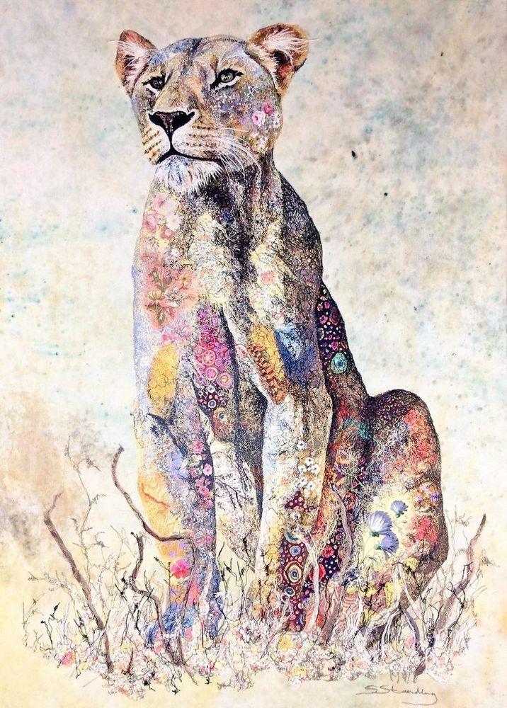 Embroidery and painting featuring a sitting lioness facing forwards 