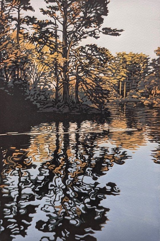 Print of a rural scene with trees reflecting on the still water of a lake or river