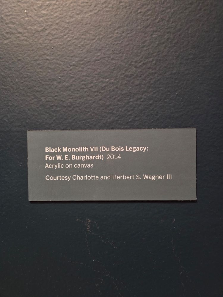 Title card for the painting. Black Monolith VII (DuBois Legacy: For W. E. Burghardt) 2014. Acrylic on canvas. Courtesy Charlotte and Herbert S. Wagner III