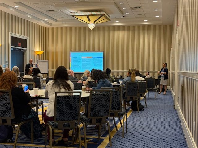 View from back of the training room of audience at this morning's Institute, with Aleece Kelly and Frank Gregory at front.