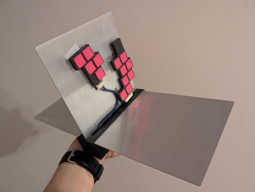 Right side of a novel ergonomic leverless controller, showing buttons and one "wing".