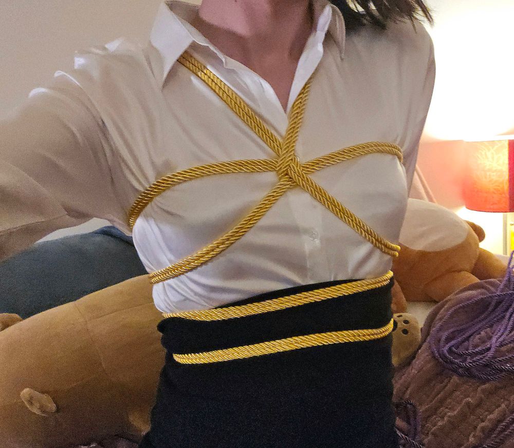 Mona is looking prim and proper in a silk blouse and black pencil skirt! Over the blouse is some shiny yellow rope tied neatly into a shibari harness. They look wonderfully ready for their interview!! Let's hope it goes well!! 