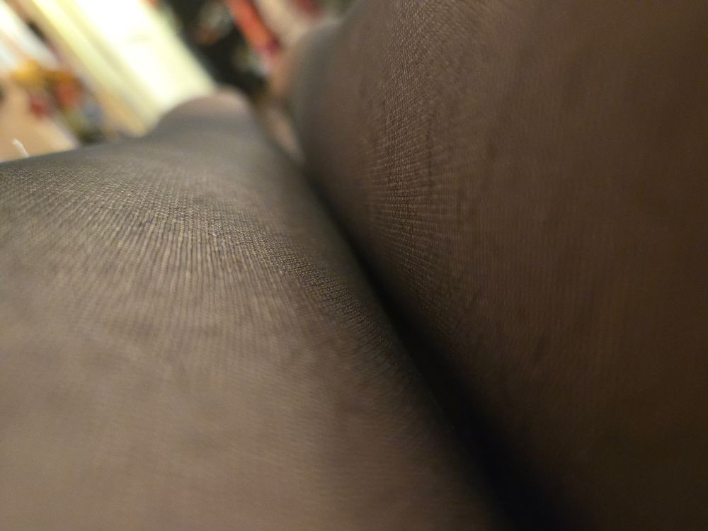 Anotherotherother closeup of Mona in semi-opaque black nylon tights layered over light gray lace- oh, wait, her panties aren't in this shot. Yeah this is just a closeup of Mona's legs. 