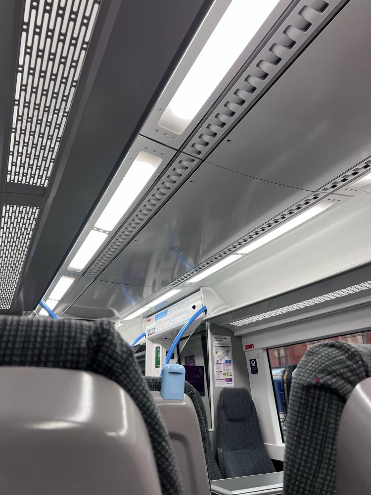 Pictures of bright white lights in train carriage. 