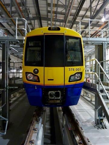 End on picture of train 378 001 in London Overground livery inside New Cross Depot