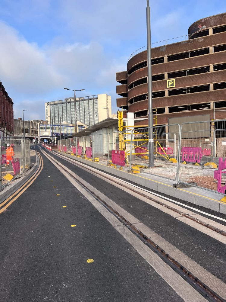 Picture of new team infrastructure including a new stop/shelter in the middle of the road.  