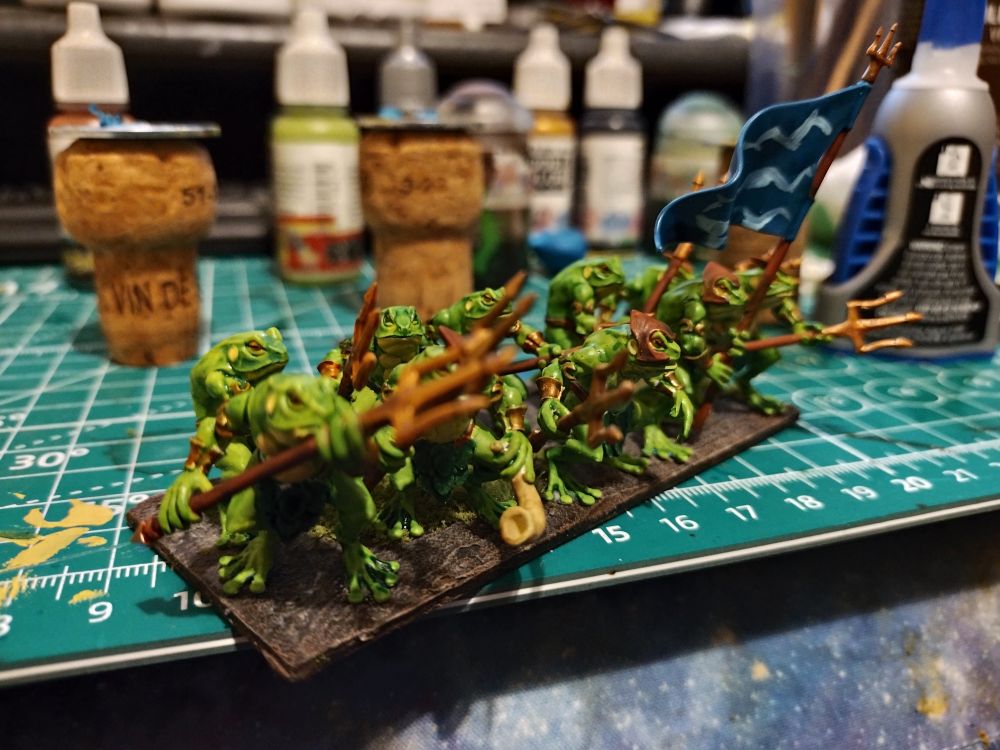 A small unit of miniature frog men.