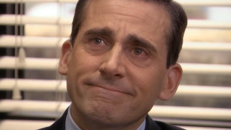 Michael Scott smiling while tearing up
