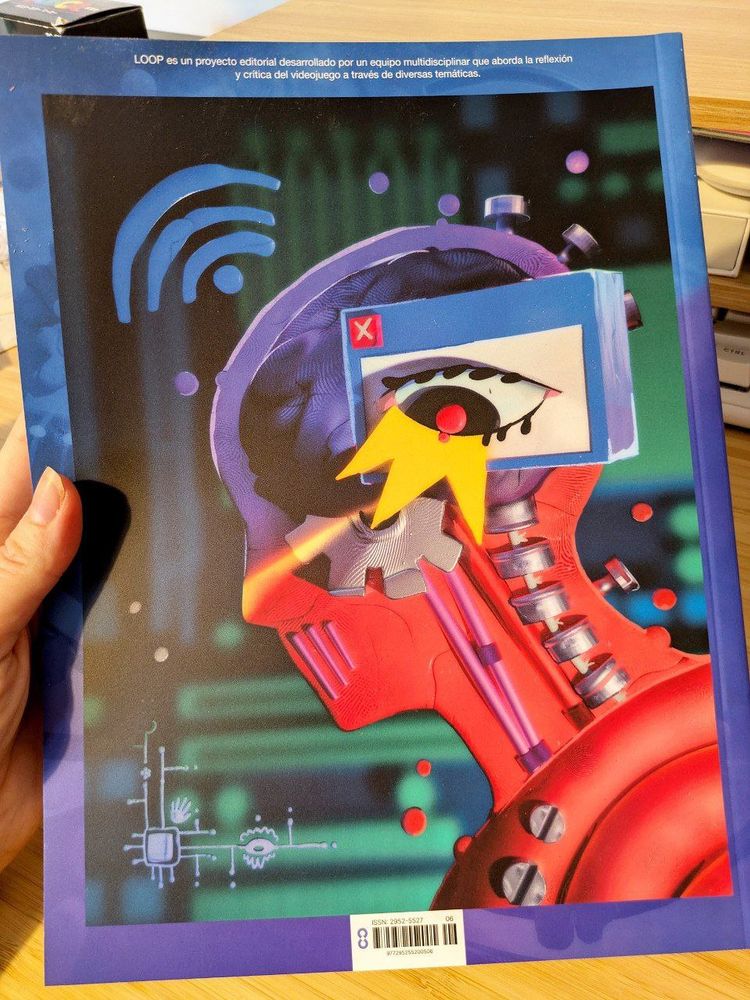 Contracubierta de la revista Loop, sale una figura humana de perfil y se ve su cerebro con cables, tornillos y un engranaje. Por encima hay un ojo humano en una ventana de programa informático.
