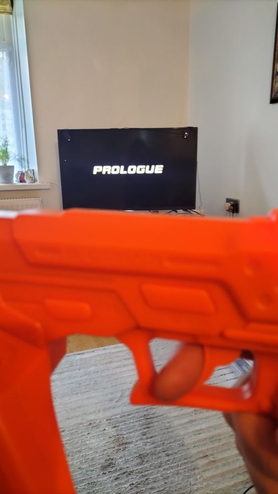 Time Crisis 4 on the PS3, and an orange G-Con light gun. Duck Hunt who?