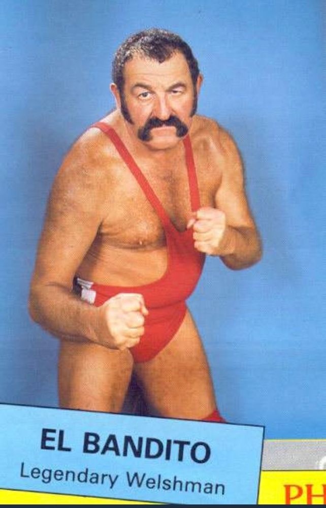 El Bandito, Legendary Welshman

A pot-bellied, moustachioed man in a leotard type effort, standing as if to fight the Marquis of Queensbury. 

Why a Welsh man has a Spanish name is none of my business.