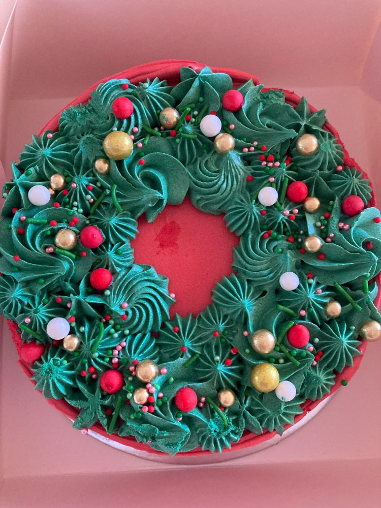 A photo of the top of a brightly coloured cake. 