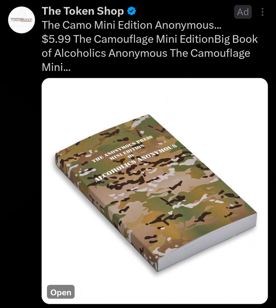 twitter ad from "the token shop" featuring a camo mini edition of the big book of alcoholics anonymous, with a picture of said camouflage cover of the alcoholics anonymous text